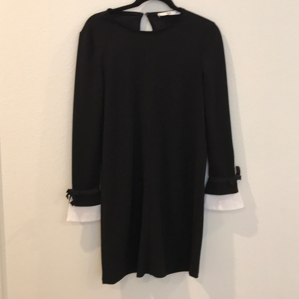 Classic black dress with white pop at sleeve